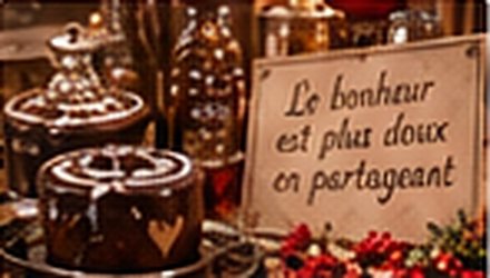 Chocolats et pancarte : Le bonheur est plus doux en partageant